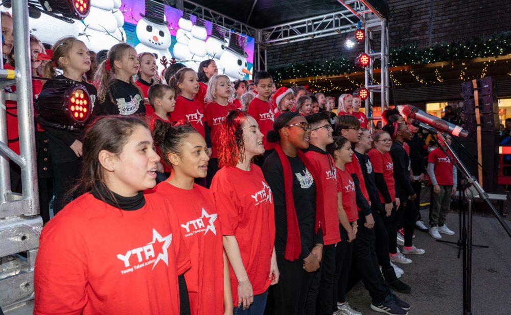 Singers from Young Notes and Young Talent Academy perform on stage during a special Christmas lights switch-on event at Palace Gardens Shopping Centre last month (credit Alistair Underwood)