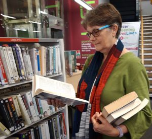 Volunteers such as Frances help choose books for the home delivery service