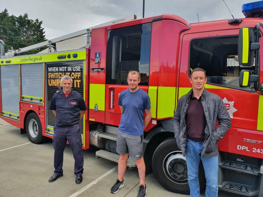 Brian Mottram (centre) was rescued as a baby by firefighters Simon Cullen (right) and Billy Merrifield (left)