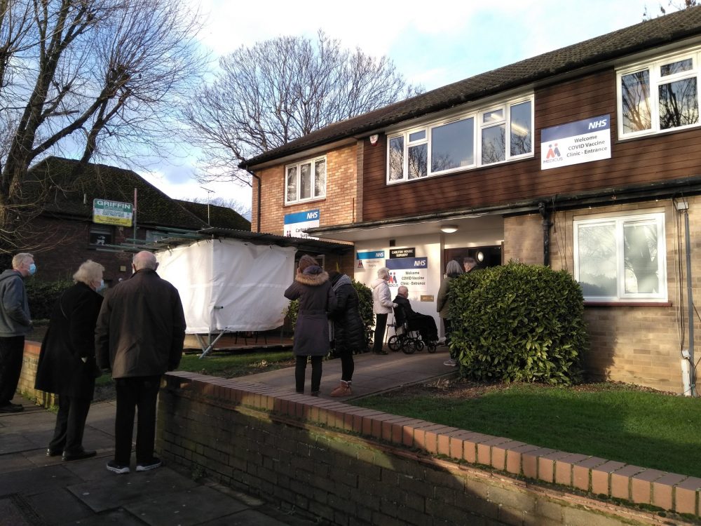 Patients queue for Covid-19 vaccinations at Carlton House Surgery in Enfield