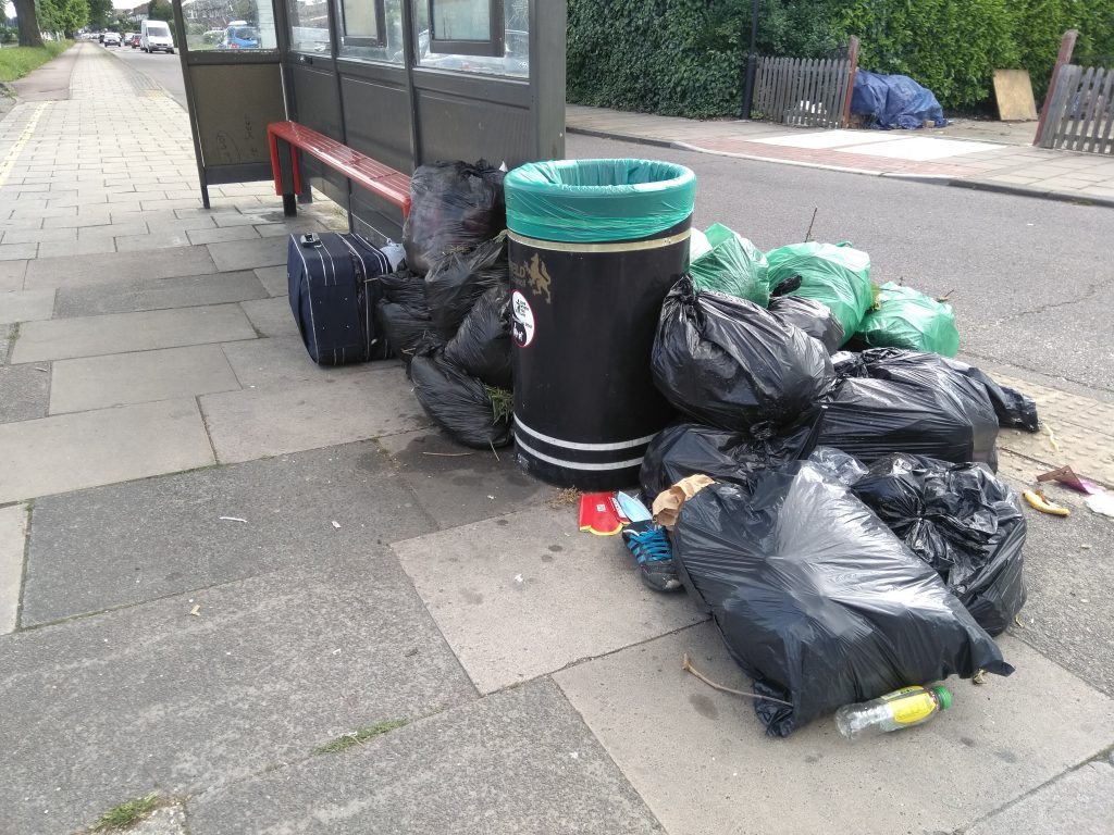 Temporary plain black council rubbish bags