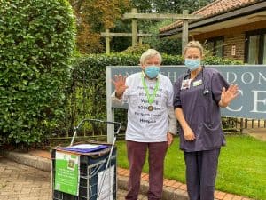Peter Murray celebrates the completion of his 1,000-mile walk at North London Hospice with medical director Sam Edwards - and the start of a new 5,000-mile mission