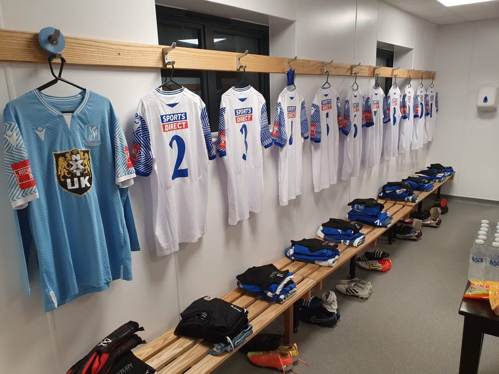 The well-prepared Enfield Town dressing room on a matchday, with every player's kit neatly laid out