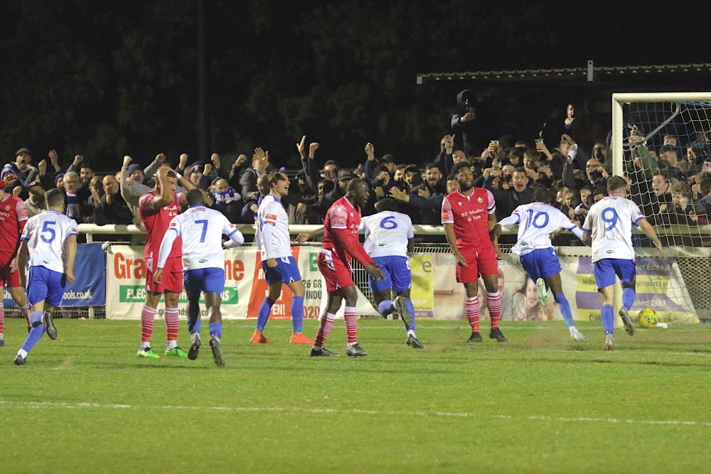 Mo Faal wheels away in celebration as Enfield Town took a 2-1 lead in the second-half, before succumbing to a 3-2 defeat against Hornchurch (credit Phil Davison)