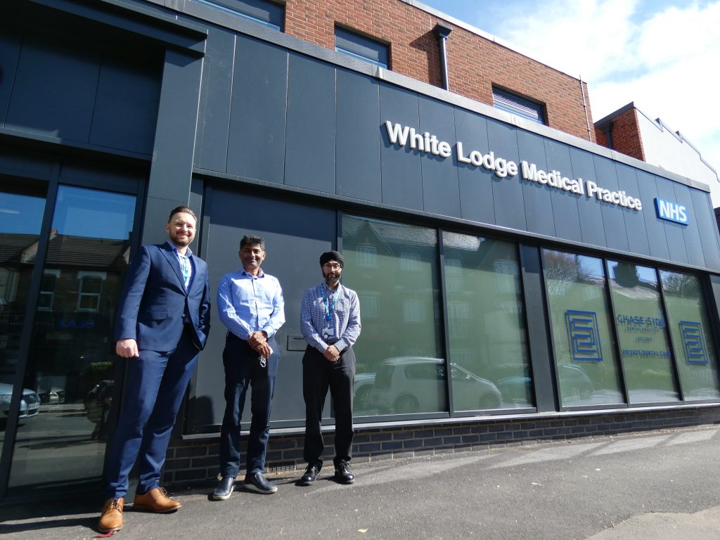 Outside the entrance to White Lodge Medical Practice, from left, are practice manager Maciej Karas and GP partners Alpesh Patel and Harry Grewal