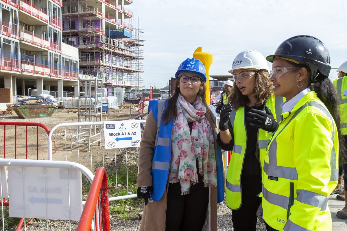 Council leader Nesil Caliskan (in blue hat) pictured on a visit to Meridian Water this week where there was a 'topping out' ceremony for the Meridian One development