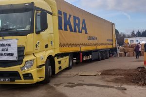 One of the lorries paid for by donations to the British Alevi Federation's earthquake appeal is loaded with donations before leaving Enfield