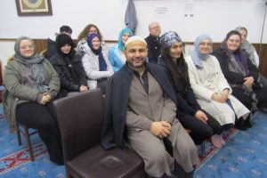 Imam Adam Kantar (front) with visitors to Rumi Mosque