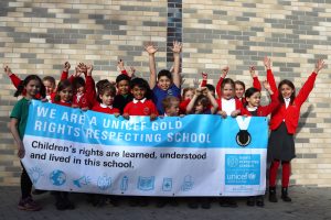 Walker Primary School children celebrate the award from Unicef