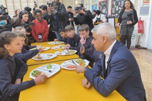 Sadiq Khan speaking to children on a visit to a primary school