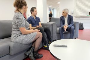 Sadiq Khan speaks with a guest at the homeless hub run by Depaul and New Horizon Youth Centre. (credit Noah Vickers/Local Democracy Reporting Service)
