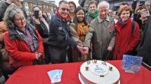 Enfield mayor Doris Jiagge cuts the 90th birthday cake for Southgate Station