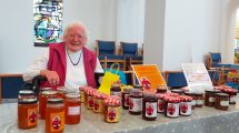 Margaret with a stand of her jam and marmalade at St Thomas's Church in Oakwood