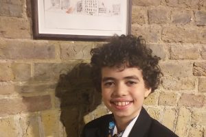 Zac Maw with the artwork sold at auction for charity