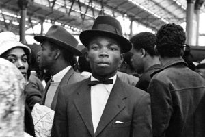 Arrivals from the Caribbean pictured at Waterloo Station in 1962 (credit Wikimedia Commons)