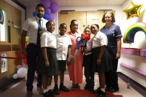 From left, North Mid's deputy chief executive Bimal Patel; mother Lee Anne with her four kids; Rainbow Ward manager Clare Oliver