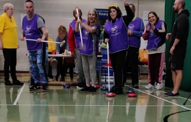 The One-to-one team competing in curling