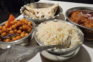 Channa masala (spiced chickpeas), pilau rice, chicken rezala and a chapati