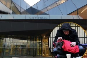 City Hall and (inset) a rough sleeper in the capital
