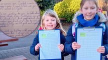 Isobel and Poppy with their petition and (inset) their letter to supermarkets