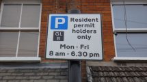 A sign warning of a controlled parking zone in operation