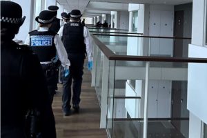 Officers raid a property in Newham (credit Met Police)