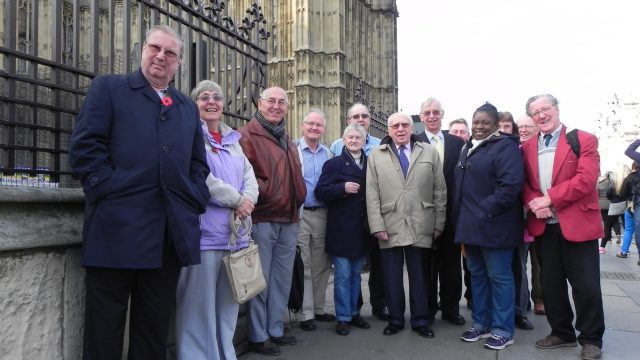 Members of Enfield Over 50s Forum outside parliament in 2014, including former president Monty Meth who died in 2021