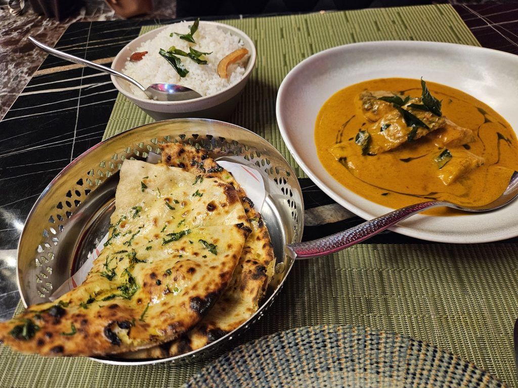 Goan fish curry with kulcha and coconut rice