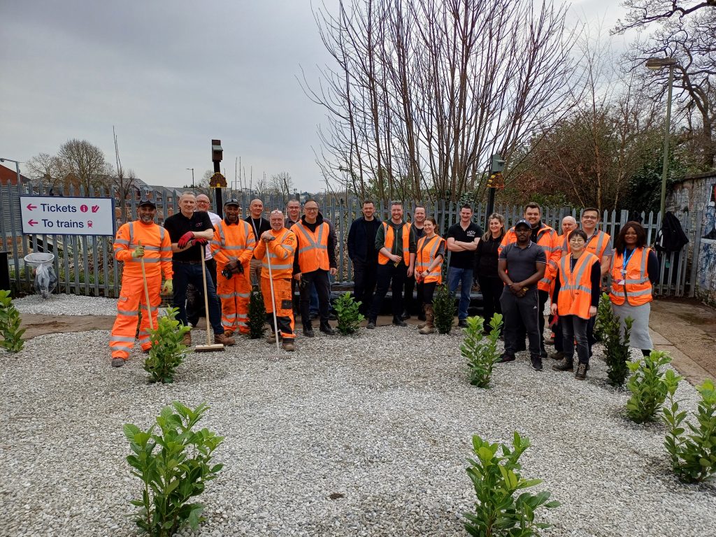 Staff at New Southgate alongside the newly planted area