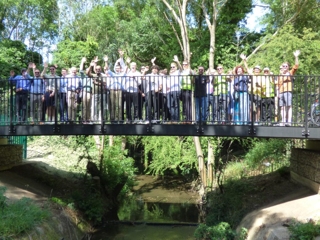 Attendees of the official launch event gather on the brand new bridge over the Turkey Brook