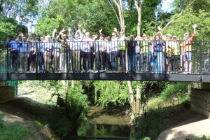Attendees of the official launch event gather on the brand new bridge over the Turkey Brook