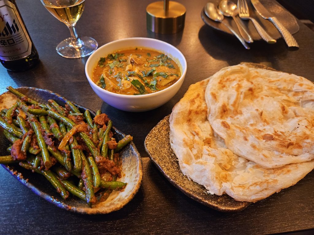 Roti canai with chicken curry and green beans