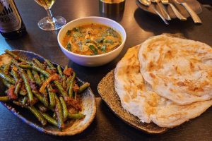 Roti canai with chicken curry and green beans