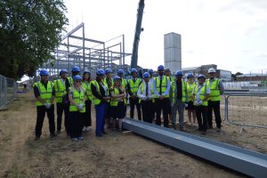 Local leaders, school staff and pupils on the building site at Chace Community School
