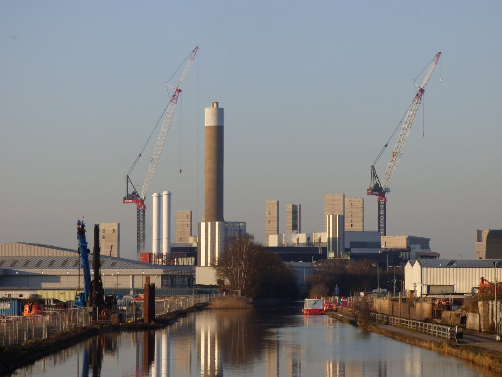 The new incinerator under construction, as the old one continues to burn the borough's waste