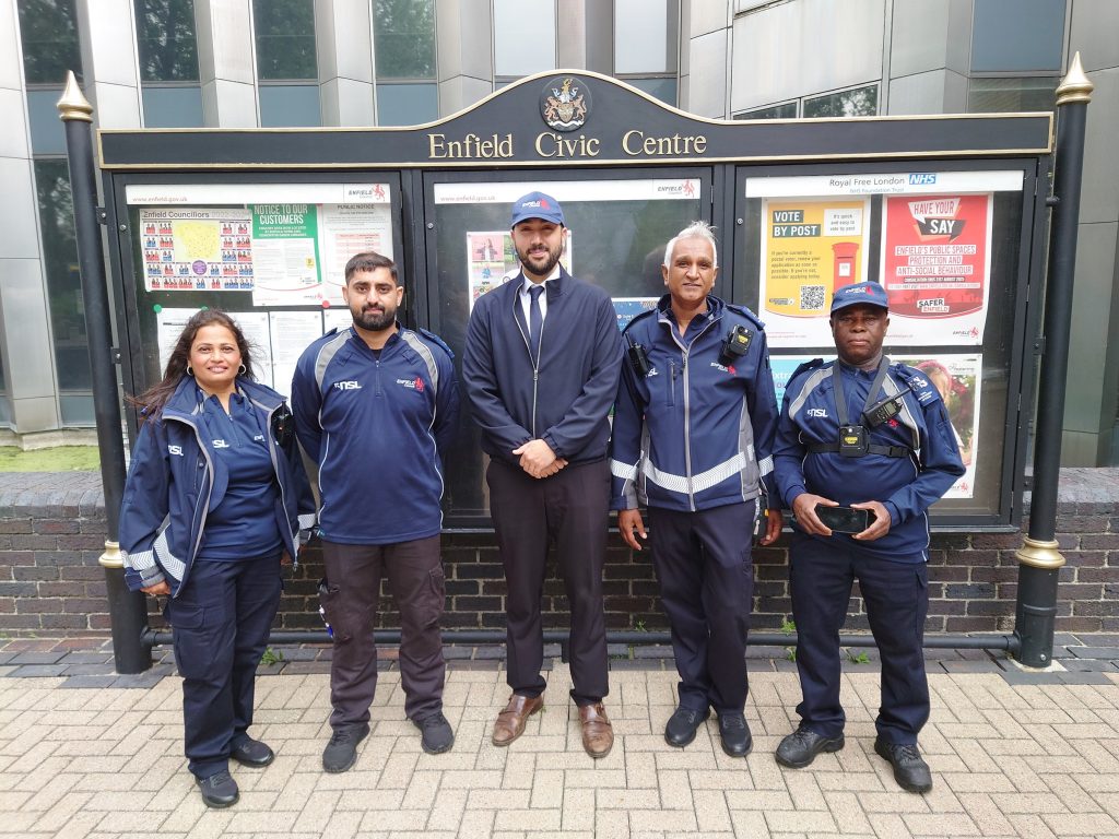 Council leader Ergin Erbil (centre) with parking enforcement offices at Enfield Civic Centre (credit Enfield Council)