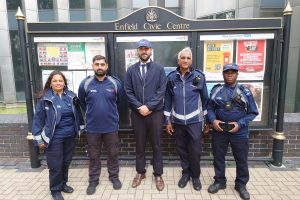 Council leader Ergin Erbil (centre) with parking enforcement offices at Enfield Civic Centre (credit Enfield Council)