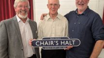 Dave Cockle (centre) was presented with a railway totem by incoming co-chairs John West (left) and John Cole (right)