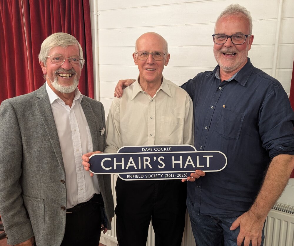Dave Cockle (centre) was presented with a railway totem by incoming co-chairs John West (left) and John Cole (right)