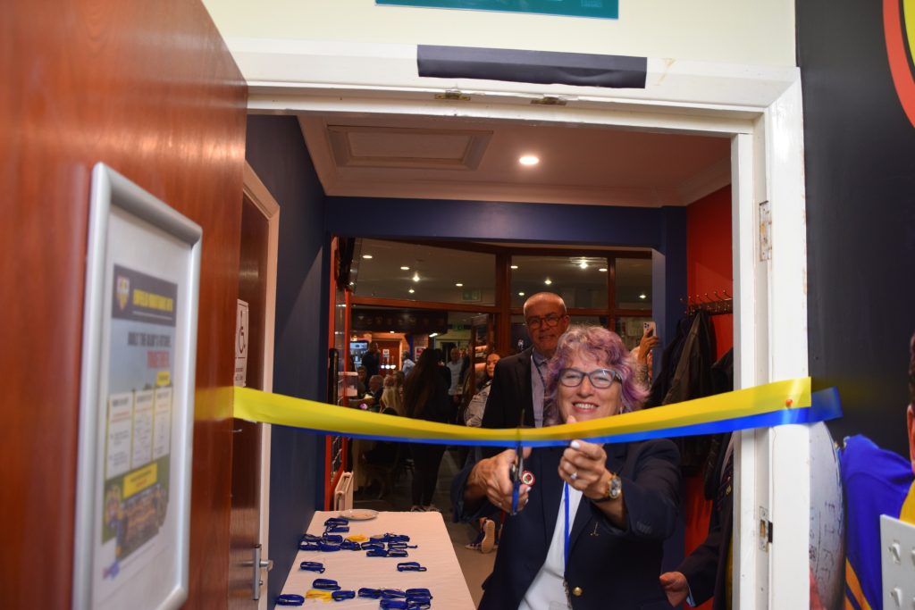 RFU president Deborah Griffin OBE cuts the ribbon on the new facilities at Enfield Ignatians' clubhouse
