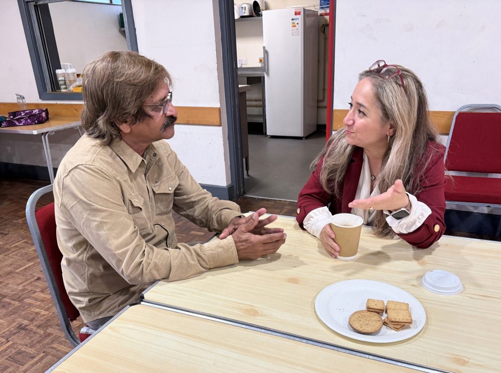 Feryal Clark chats to a constituent at her Bullsmoor coffee morning