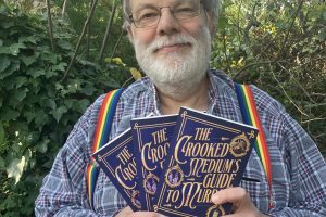 Stephen Cox with his new novel, The Crooked Medium’s Guide to Murder
