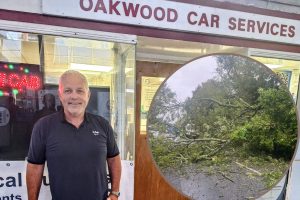 Terry Williams of Oakwood Cars and (inset) the tree which fell on the road