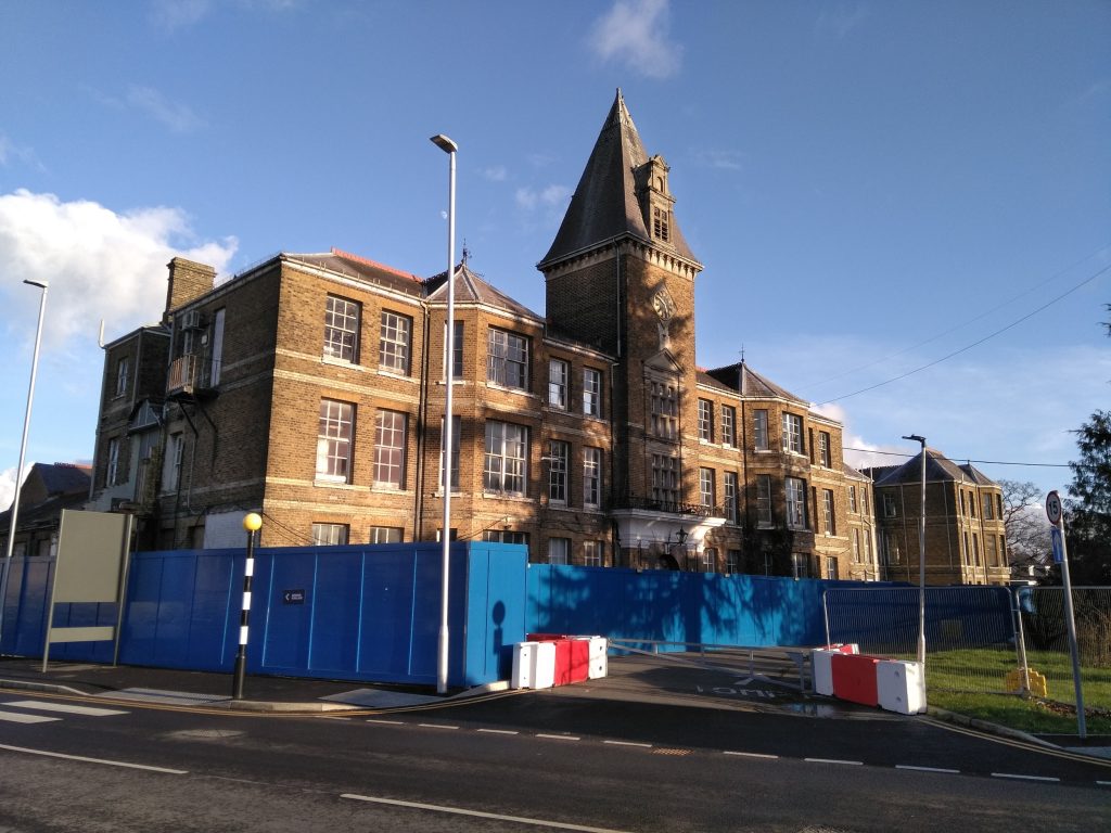 The clock tower at the old hospital will be restored and converted into housing