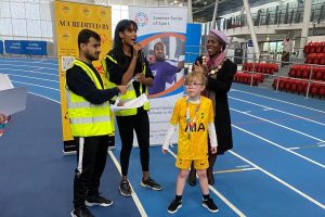 Children receive their medals at Lee Valley Athletics Centre during the SEN Sports Champions Inclusive Athletics Event