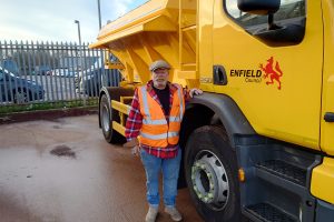 Cabinet member Rick Jewell with one of the council's gritting lorries (credit Enfield Council)