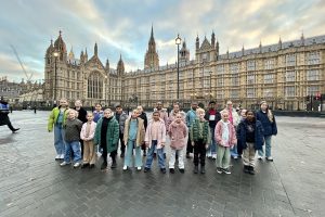 Young Notes Choir outside the Houses of Parliament