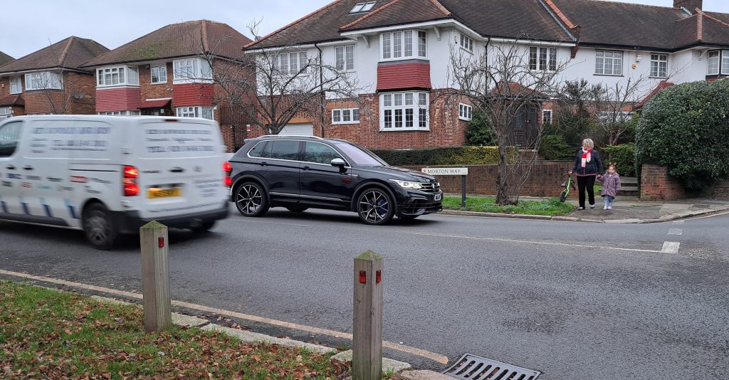Joan Bushill pictured waiting to cross Morton Way with her grandchild