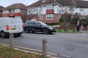 Joan Bushill pictured waiting to cross Morton Way with her grandchild