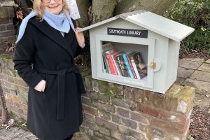 Maggie with the new book exchange outside her house in High Street, Southgate